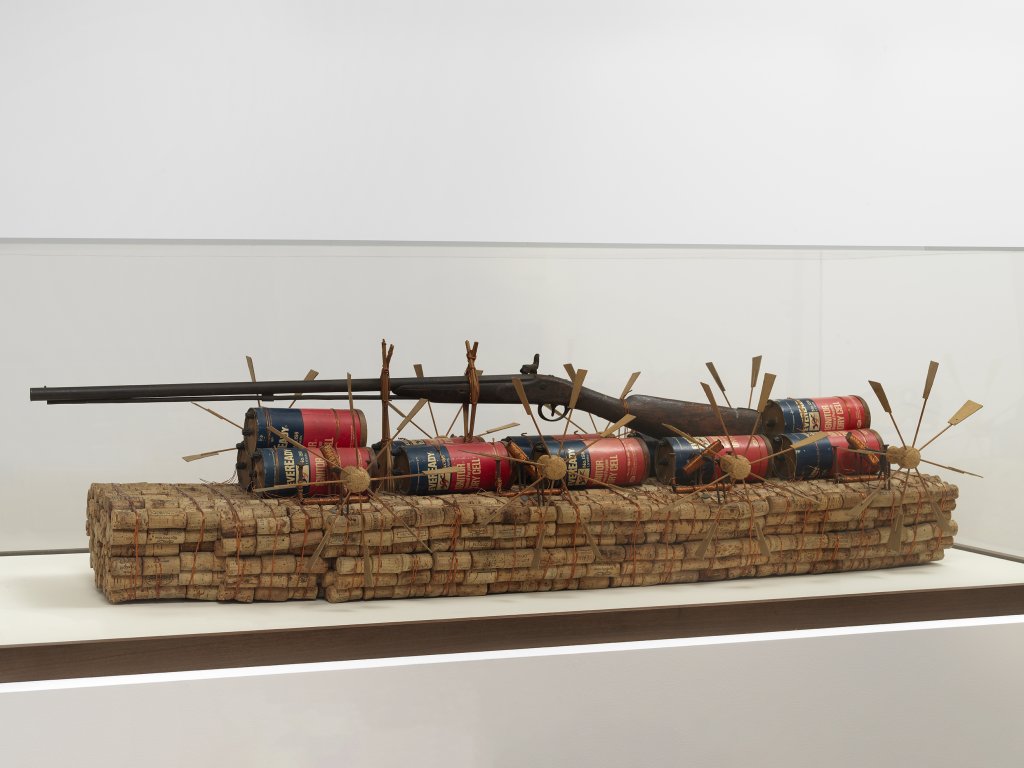 Chris Burden The Ship-O-Corks, 1983 2,700 wine and champagne corks, copper wire, 12 dry cell batteries, wood, cardboard, child's nineteenth-century shotgun, eight paddle wheels, bamboo, nails, and electric tape 12 x 54 x 12 in. (30.5 x 137.2 x 30.5 cm.)